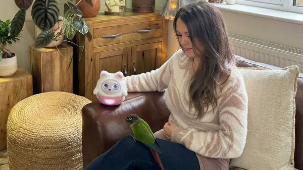 Hannah with Pophie and her parrot